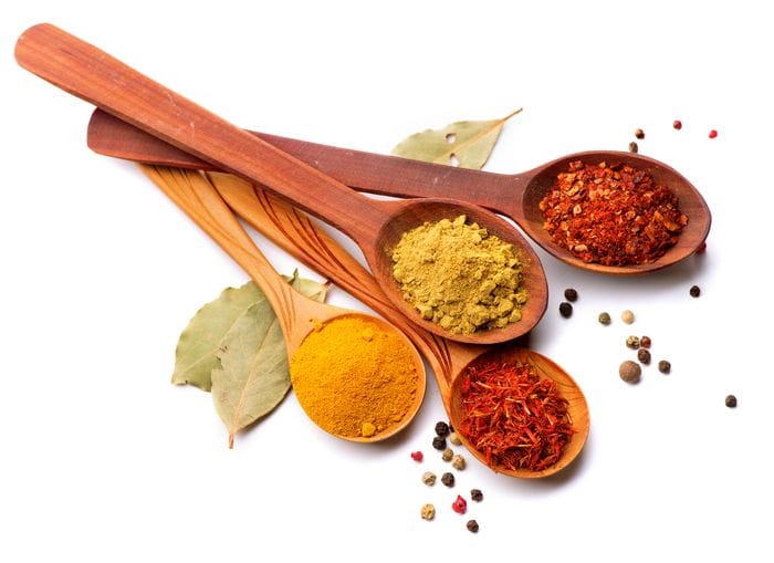 Regional products – herbs and spices on wooden spoons
